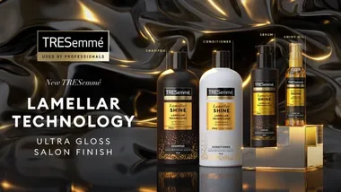 Four products from TRESemme's premium Lamellar Shine range, masstige products enriched with technology to improve hair shine. Bottles are black, white and gold.