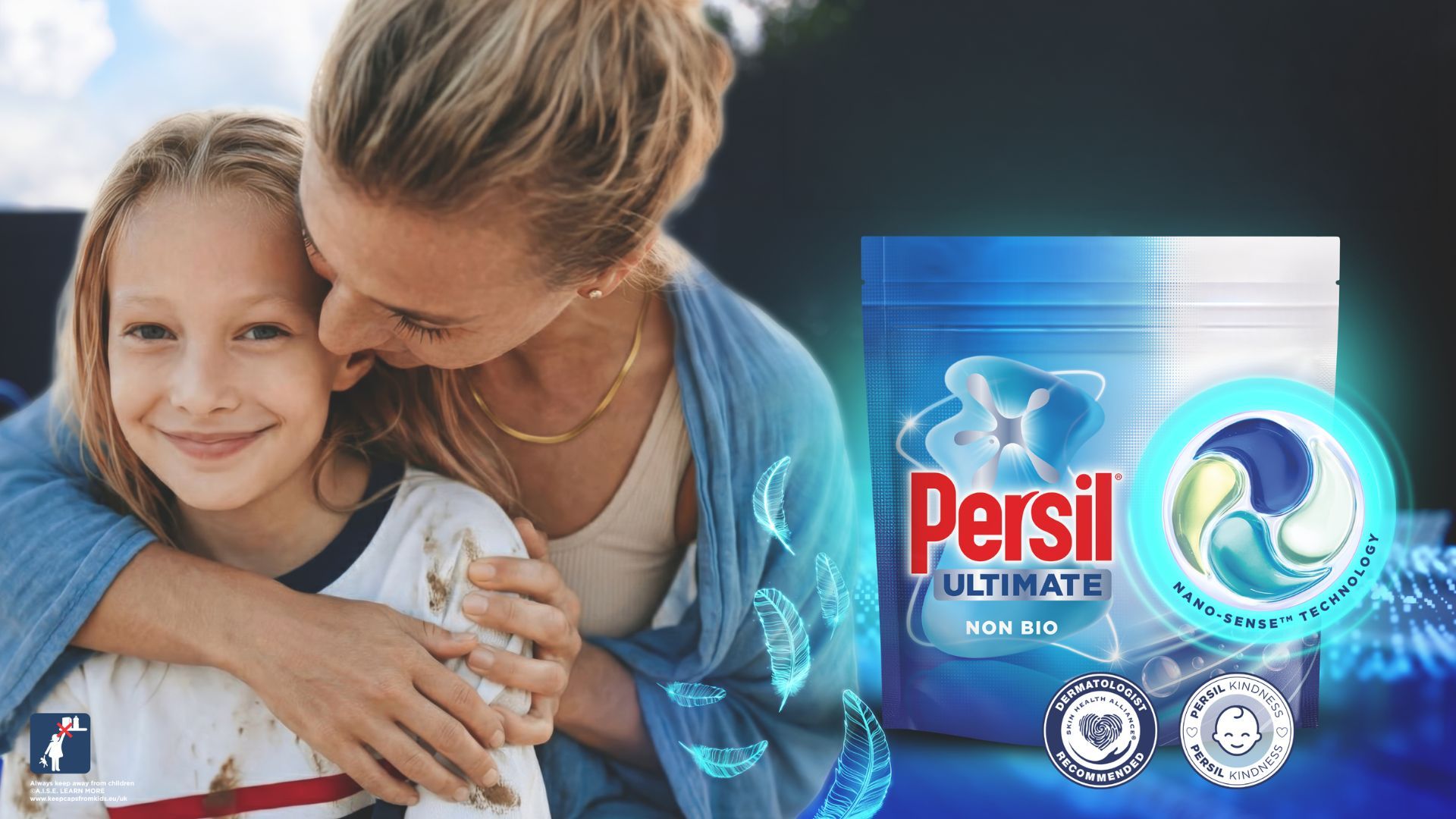 Adult hugging child beside Persil Ultimate Non Bio pack, highlighting stain removal and fabric care benefits.
