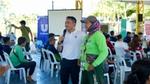 A Unilever team member engaging with a waste worker