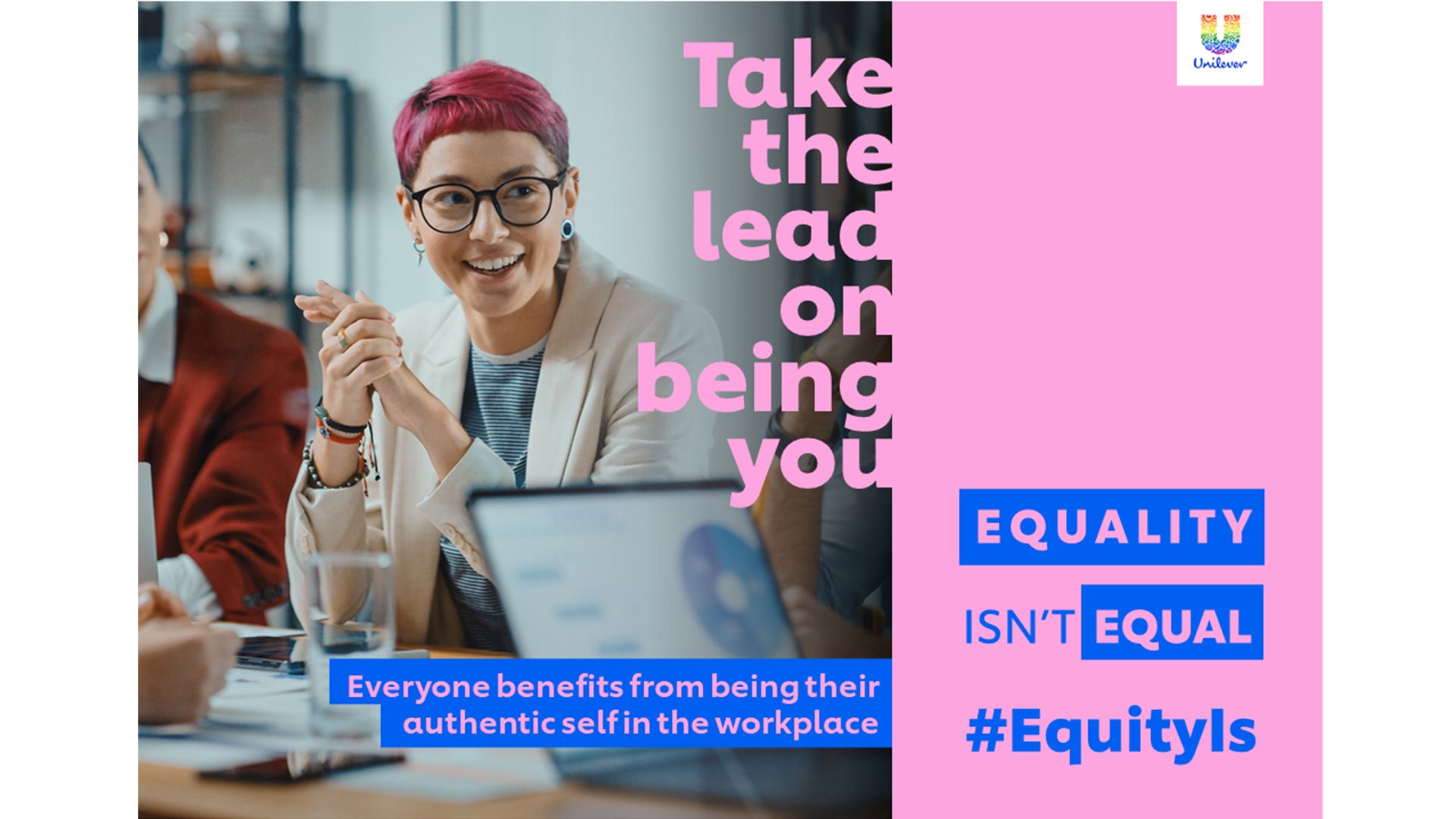 Two women and a man seated during a meeting.