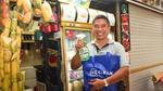 Man happily holding a cif spray bottle