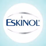 Eskinol is written in blue, with a drop in place of the dot on letter i. A silver oval surrounds the word.